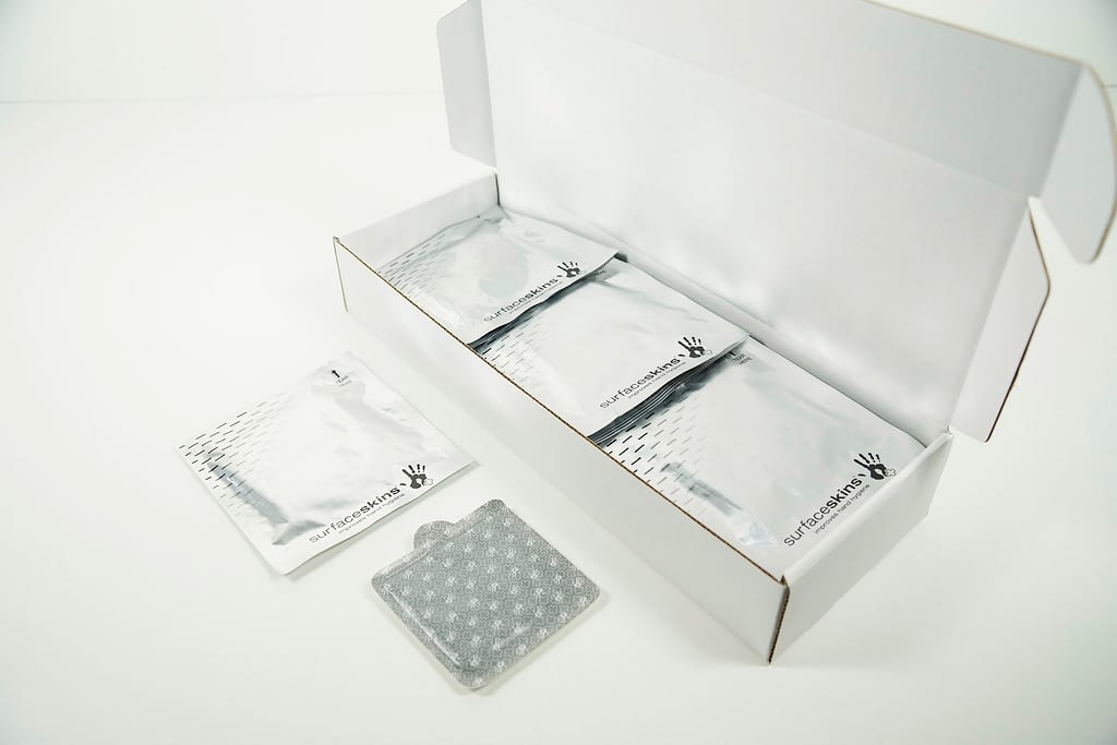 Small Pack, Surfaceskins, Stick + Protect, Surfaceskins Alcohol Gel, Hygiene Slimline Pad, hygienic, trolley handle, D-Handle, handle, trolley, crank, mini handle, virus, bacteria, antibacterial, self-disinfecting, self-disinfects, self-sanitising, sanitizing, contaminate, antimicrobial, pushpad, push plate, door, gel, 70%, alcohol, gel, surface, touchpoint, germs, self cleansing, self, cleans, infection, prevention, low cost, clean, stay clean, infection, wellness, offices, staff protection, employee, protect, infection control, infection prevention, pandemic, covid19, corona, corona virus, c19, MRSA, C-Diff, norovirus, pathogen, S.Aureus, C-Diff, Noro-Virus, c-difficile, E-Faecalis, Salmonella, e-coli superbugs, HAI’s, hygiene, systems, protection, NHS validated, in-vitro, bug, protect, fingers, transmission, spread, touch, hold, pull, press, alcohol gel, Returntowork, work, office, hospital, clinic, GP, surgery, theatre, dental, dentist, NHS, pathogen, cruise ship, care-home, gym, restaurant, dairy, events, brewery, factory, foodpreparation, sportsevent, event, food, education, school, university, business, UK, design, innovation, 2021,